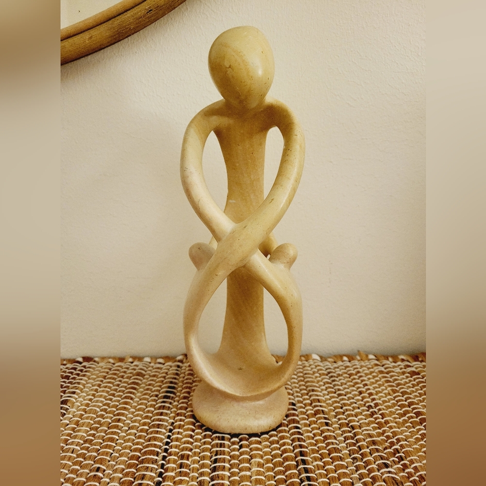 Cute marble statue person with children